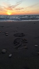 Footstep print on sand during sunset on beach, Preveza, Greece