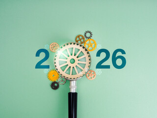 2026 new year with green business trends, planning, goal and success management concept. Calendar numbers with wooden gear in magnifying glass lens, surrounded with many cogwheels on green background.