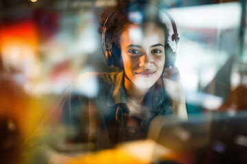 Young woman listening to music with headphones indoor