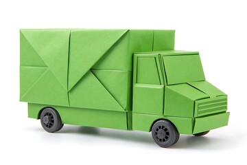 A green origami truck with geometric folds sits isolated against a white background