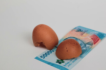 Cracked Egg with Indonesian Rupiah – Concept of Food Inflation and Rising Living Costs