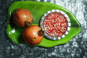 Fresh pomegranates with juicy red seeds, rich in antioxidants, vitamins, and flavor, perfect for...