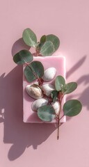 Pink soap bar with eucalyptus leaves and nuts