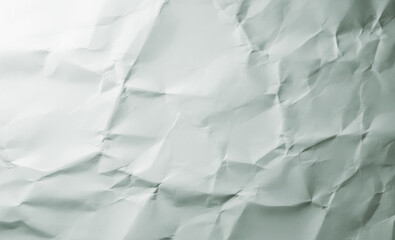 Obraz premium Close-up of crumpled white paper showing shadows and texture.premium paper texture photo for poster, banner, and pamphlet background