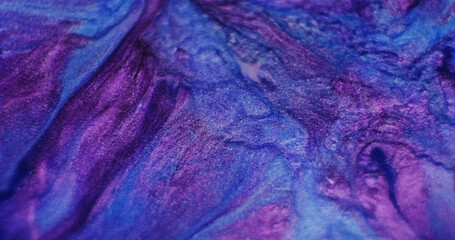 Blend ink. Abstract stains. Defocused blue purple colorful stream water liquid emulsion particles...