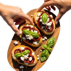 Hands are reaching for bruschetta with sundried tomatoes, feta and basil isolated on transparent background