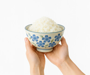 手で持つ炊きたてご飯と和風食器