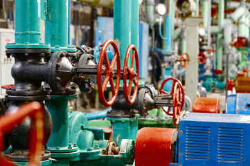 Industrial water pumping station features valves and machinery for efficient fluid transportation...