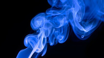 Obraz premium Blue Smoke Abstract: An ethereal swirl of vibrant blue smoke against a stark black background, creating a mesmerizing abstract image perfect for design projects.