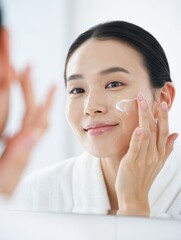 Woman Applying Facial Cleanser in Bathroom