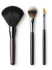 Three makeup brushes isolated on white: a fan brush, a powder brush, and a sponge-tip brush. Perfect for beauty, cosmetics, or makeup tutorials.