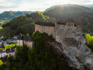 Obraz premium Orava castle or oravsky hrad in Oravsky Podzamok in Slovakia. Medieval castleon high cliff by the Orava river.