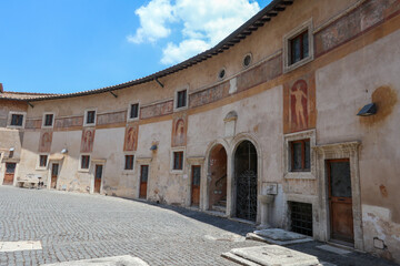 Alexander VI Courtyard, which gives access to the prisons in the Castle of Sant'Angelo, a semicircular interior area, a sunny summer day