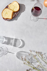 Sliced bread with red wine in bright, overhead composition