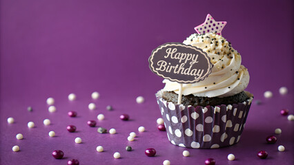 Festive Cupcake Celebration: A single, artistically crafted cupcake, adorned with "Happy Birthday" and a star topper, takes center stage against a vibrant backdrop. This image exudes joy. 
