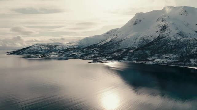 Reflection Of Bright Sun In The Tranquil Water Of Sea In Lodingen, Nordland, Norway. - aerial shot
