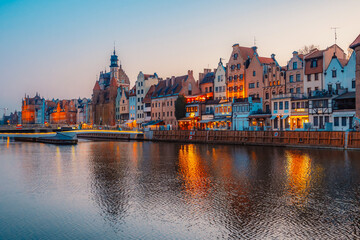 Gdansk with Motlawa river in Poland. Old town colourful house with Zuraw or crane and with Holy Spirit Gate