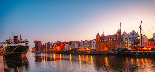 Gdansk with Motlawa river in Poland. Old town colourful house with Stragania Gate