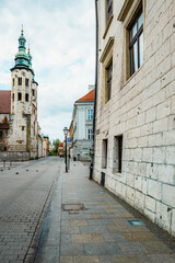 Main street Rynek Głowny in Krakow with square and church St. Mary's Basilica in Poland