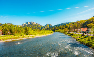 Peak Tri Koruny or Trzy Korony during day with green meadow and trees in spring. Pieniny National park in Slovakia and Poland © Zedspider