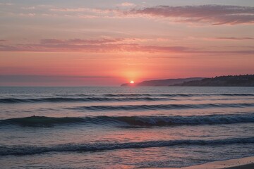 Obraz premium Tranquil Coastal Sunset with Calm Waves on the Horizon