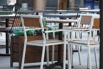 Outdoor cafe seating arrangement with chairs and table