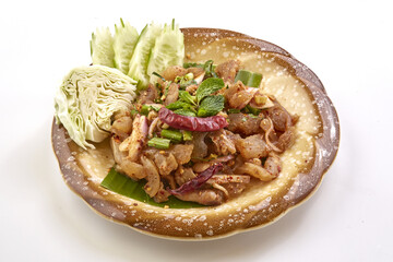 Spicy beef tendon salad served with fresh cabbage, cucumber, and garnished with mint leaves on ceramic plate, showcasing vibrant colors and flavorful presentation
