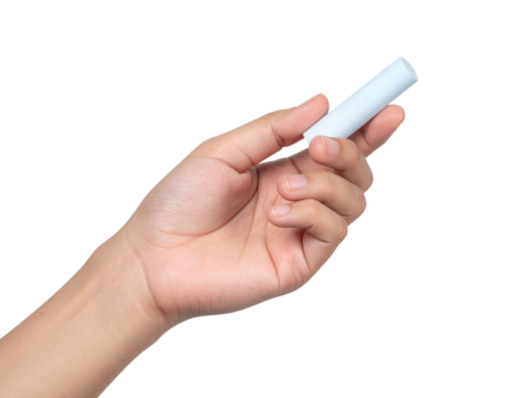 A hand holding a piece of white chalk against a black background.