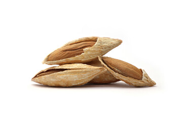 A small pile of healthy raw in-shell almonds with some cracked open on white background.