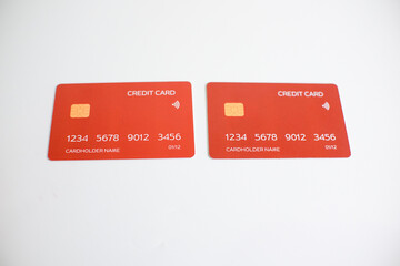 credit card, modern payment tool, transaction tool, two red credit cards isolated on a white...