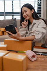 she in an entrepreneur, she sells product online, she own a small business that sell product online, sme, a lot of parcel stack in the room, working in her shopping online storage