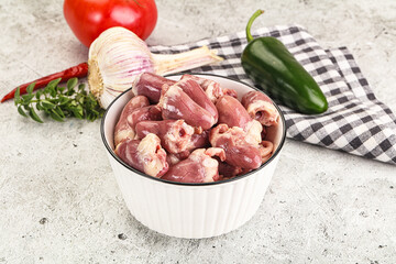 Fresh raw chicken hearts in the bowl
