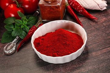 Spicy dry paprika powder in the bowl
