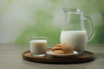 jug of milk, cornflakes on wooden background