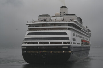 Classic cruiseship cruise ship liner Zaandam arrival into Vancouver, Canada port on grey foggy...