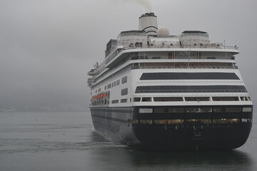 Classic cruiseship cruise ship liner Zaandam arrival into Vancouver, Canada port on grey foggy...