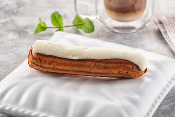 White vanilla eclair with icing