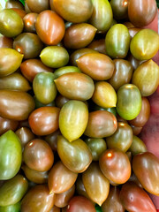 lots of green tomatoes for cooking as background