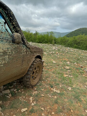 SUV Car In Mud On Mountain On The Road
