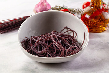 Boiled black rice noodles spaghetti