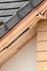 Birds nesting under old roof that loose or broken externalceiling.