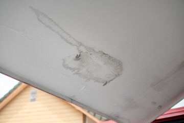 Stain on the ceiling couse of roof tiles leaked.