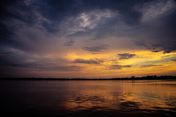 warm orange and yellow sunset over the lake