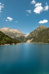Lac d'Oredon in the French Pyrenees with the dam wall of Lac-de-Cap-Long in the distance