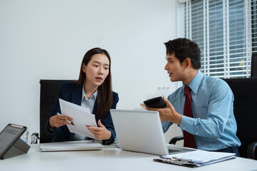 Close up Busines swoman and partner using calculator and laptop for calculation finance, tax, accounting, statistics and analytic research concept.