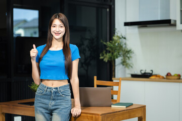 Successful business woman, excited young woman Keeping up arms and showing positive emotions, happy...