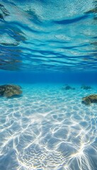 Fototapeta premium Stunning View of Sunlight Through Turquoise Sea onto Pristine White Sand Beach Paradise Scene