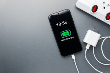 Smartphone Fully Charged with USB Adapter Unplugged for Power Management
