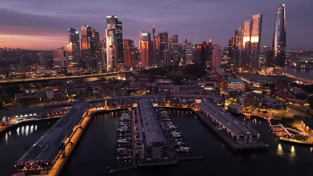 Aerial drone view of Barangaroo waterfront precinct and Sydney City, NSW Australia during an early morning sunrise in July 2025     