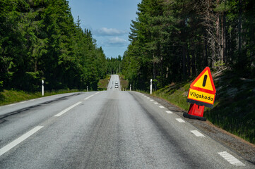 warning sign in Swedish meaning road damage